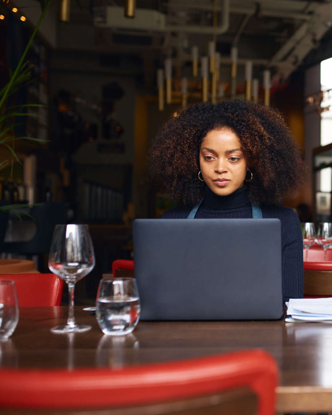 Restaurant owner reviewing mid-year financial numbers