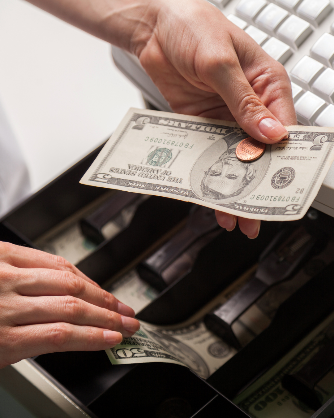 Restaurant owner reviewing seasonal revenue numbers